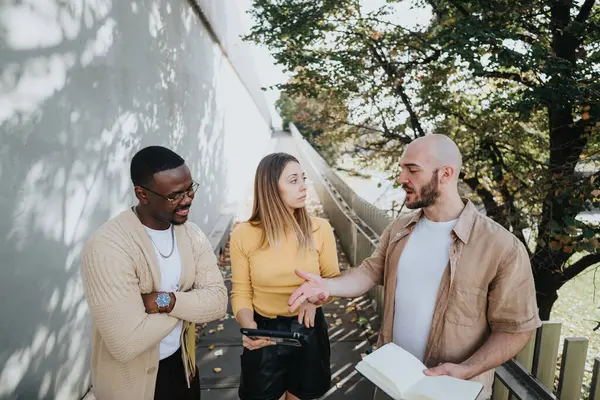 Young, diverse executives collaborate outdoors in an urban city. Business plan, profitability, market analysis, risk assessment, start up funding, growth hacking, sales, and marketing campaign.