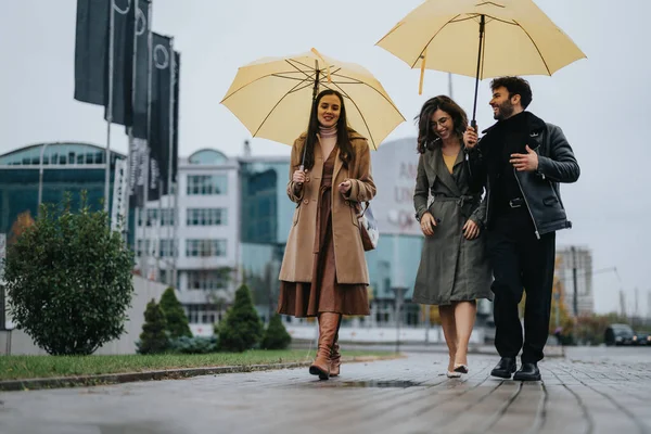 Two Women Man Laughing Together Walking Umbrellas City — Stock Photo, Image