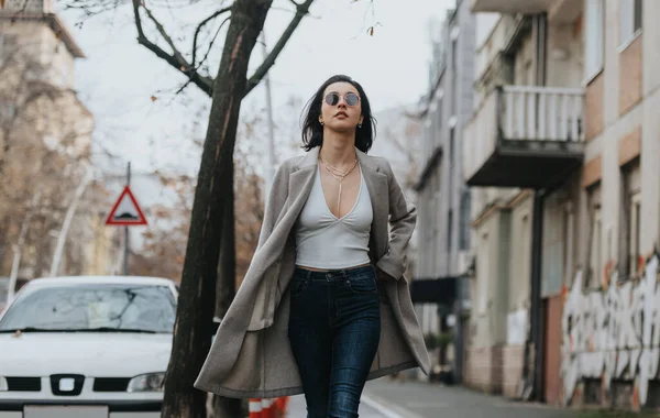 Chic Young Lady Sunglasses Stylish Coat Walks Confidence Urban Road — Stock Photo, Image