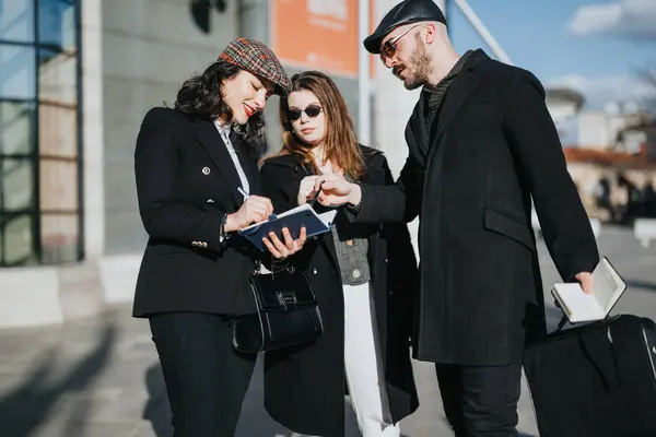 Three Young Entrepreneurs Discuss Business Ideas While Using Tablet Outdoors — Stock Photo, Image