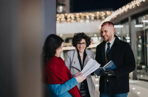 Happy Young Colleagues Formal Wear Holding Papers Discussing Business Matters — Stock Photo, Image