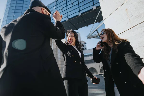 Three Young Business Professionals Cheer Triumph Backdrop Urban Architecture Embodying — Stock Photo, Image