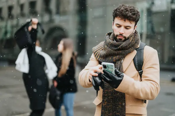 Focused Young Adult Male Winter Coat Scarf Using Phone Snowy — Stock Photo, Image