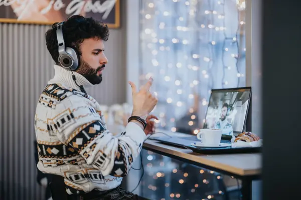 Young Man Wearing Headphones Participates Animated Online Business Meeting His — Stock Photo, Image