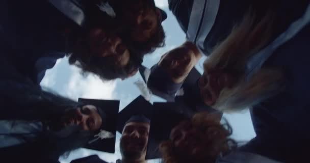 Joyous University Graduates Adorned Caps Stand Circle Huddling Together Celebrating — Stock Video