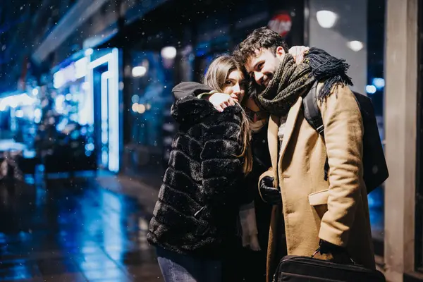Affectionate Young Couple Huddling Together Snowy Lit Urban Street Creates — Stock Photo, Image