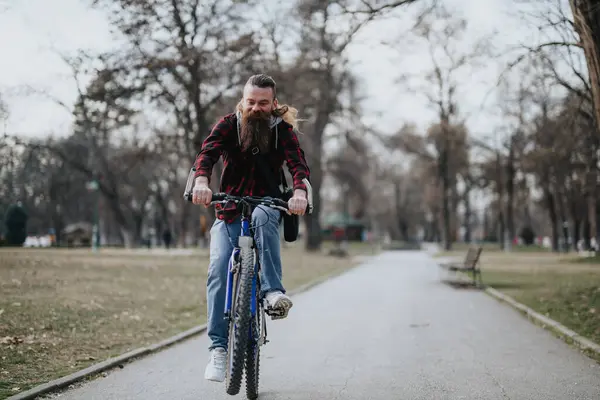 Stylish Bearded Man Enjoying Bike Ride Tree Lined Path Park — Stock Photo, Image