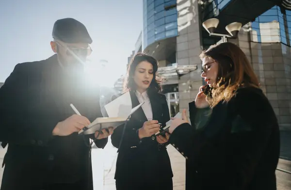 Three Young Professionals Engage Business Discussion Outdoors Using Digital Tablet — Stock Photo, Image
