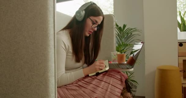 Focused Young Female Adult Headphones Engaged Remote Work Her Laptop — Stock Video
