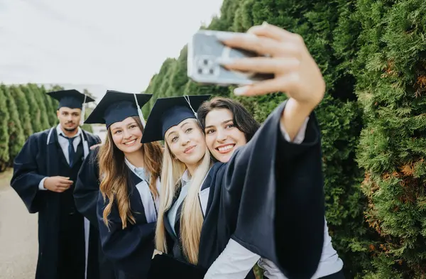 Students Graduation Gowns Caps Celebrate Successful Achievement Smiling Taking Selfies — Stock Photo, Image