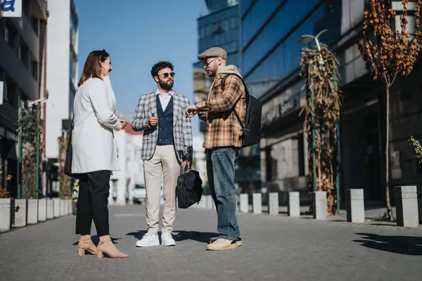 Three Young Professionals Stand Outdoors Engaging Business Conversation Focus Determination — Stock Photo, Image