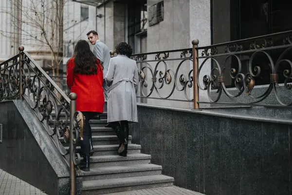 Two Business Associates Winter Attire Ascending Steps While Engaging Conversation — Stock Photo, Image
