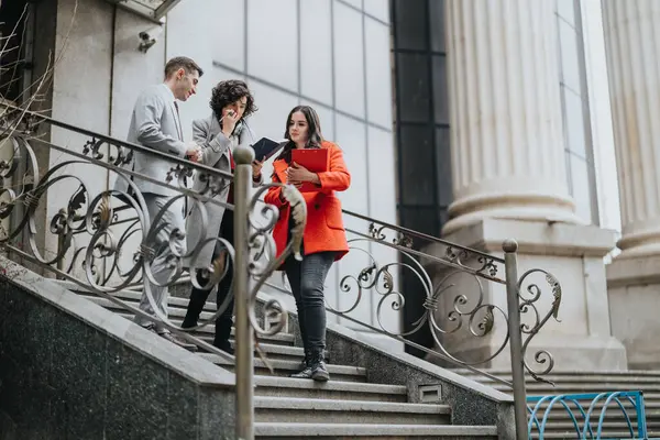 Three Lawyers Engaged Serious Discussion Outdoors Courthouse Steps Reviewing Documents — Stock Photo, Image