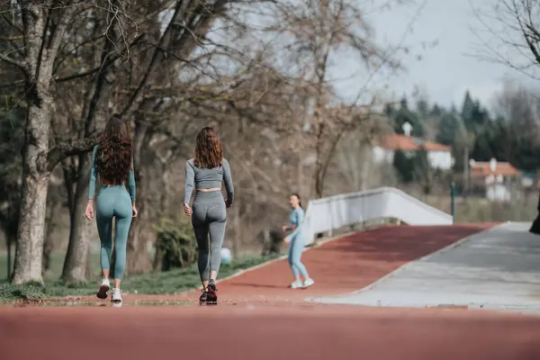 Serene Image Capturing Two Female Friends Jogging Outdoors Enjoying Exercise — Stock Photo, Image