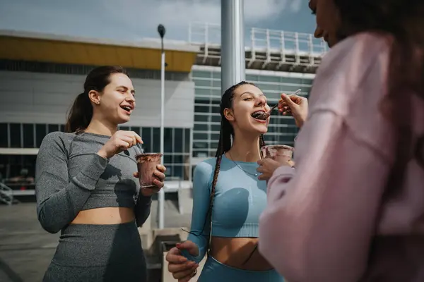 Three Friends Sharing Light Moment Nutritious Drinks Post Exercise Outdoors — Stock Photo, Image
