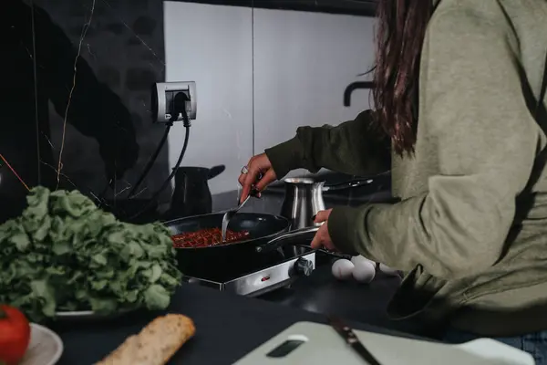 Focused Woman Prepares Tomato Based Dish Modern Kitchen Highlighting Lifestyle — Stock Photo, Image