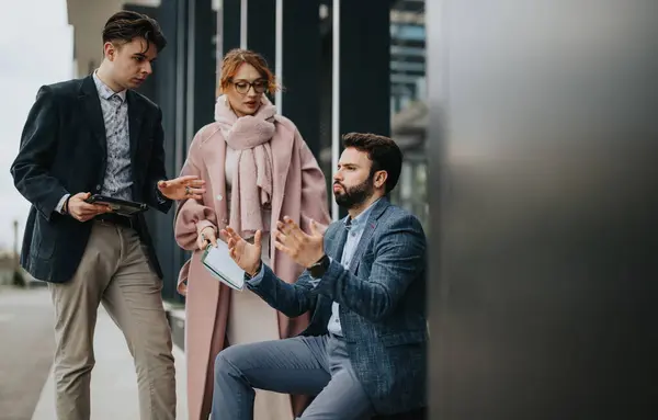 Three Business Colleagues Engaging Serious Discussion Contemporary Office Building — Stock Photo, Image