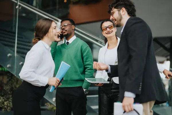 stock image Diverse group of business people engaged in a discussion about marketing and sales strategies in an informal outdoor setting.