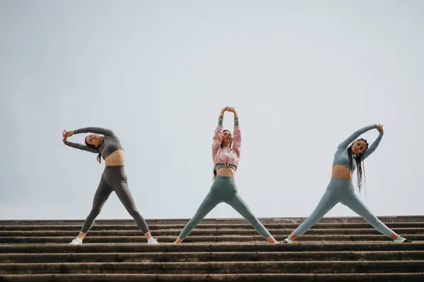 Group Three Women Sportswear Taking Break Stretch Together Outdoor Steps — Stock Photo, Image