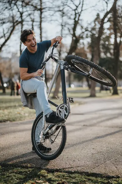 Active Adult Male Enjoys Leisure Time Performing Wheelie His Bike — Stock Photo, Image