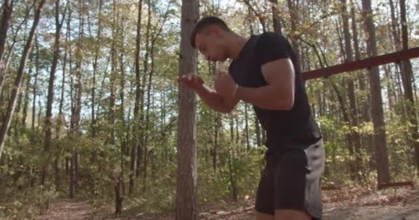 Young Athletic Man Practices Boxing Mountain Park Surrounded Lush Trees — Stock Video