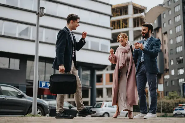 Three Business Professionals Laugh Together While Walking Showcasing Teamwork Positive Imagem De Stock