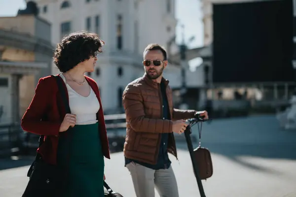 stock image Two professional businesspeople having a meeting while walking through a city area on a sunny day