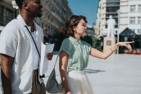 stock image Two friends navigating the city, enjoying a sunny day and the adventure of exploration with a map in hand.