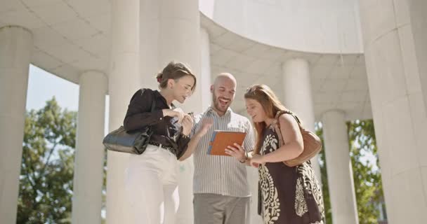 Three Business Colleagues Collaborate Tablet Celebrate Success High Five Discuss