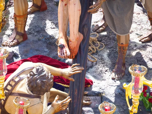 Holy Week in Spain, a nail driven into the foot of Jesus Christ in close-up.
