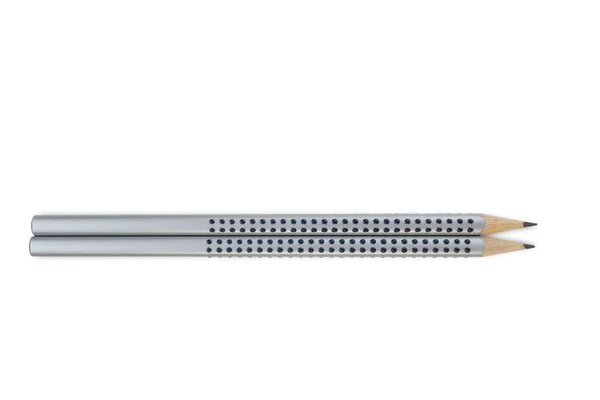 两只灰色的木制铅笔 上面有几滴胶水隔离在白色的背景上 剪切机 免版税图库照片