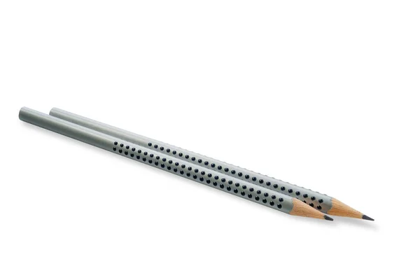 两只灰色的木制铅笔 上面有几滴胶水隔离在白色的背景上 割伤通行证 贯穿主题的尖锐程度 图库图片