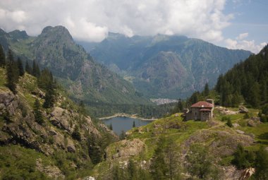 Panoramic view of alpine dam in Piedmont during summer season, Italy