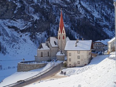 RIVA DI TURES, ITALY - JANUARY 24, 2025: Panoramic view of Riva di Tures alpine village with snow in Alto Adige, Italy clipart