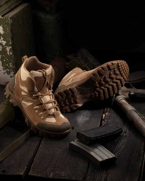 Modern practical military shoes with military accessories. Poster for advertising