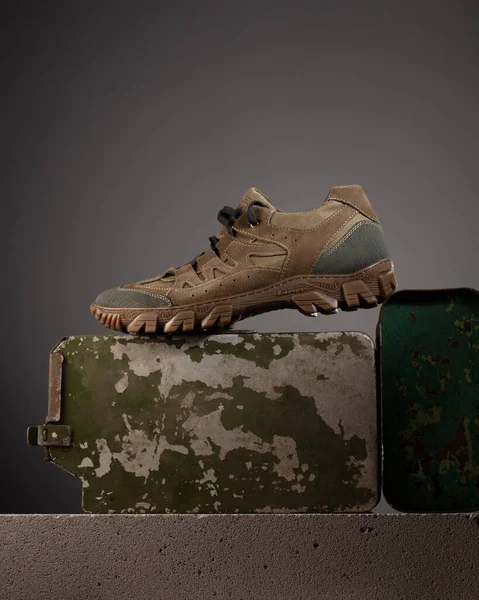 Modern practical military shoes with military accessories. Poster for advertising