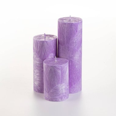 Tall handcrafted purple palm wax candle with unique crystalline texture, displayed on white backdrop. Stylish accessory for interior design  clipart
