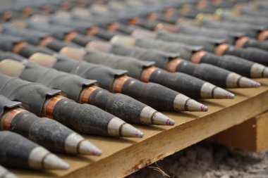 Almaty, Kazakhstan - 04.14.2022 : Ammunition is stacked in a row during military exercises. clipart