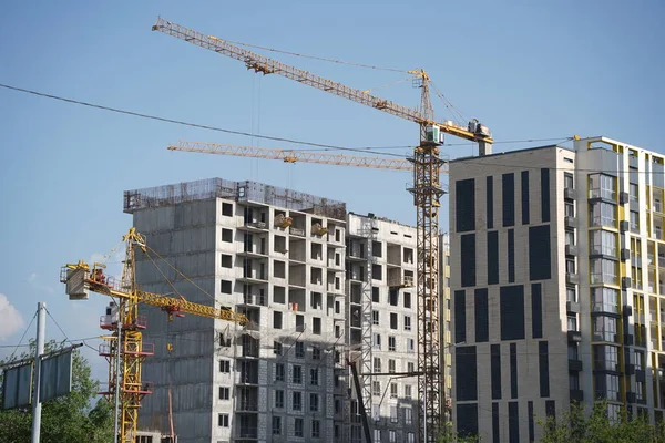 stock image Almaty, Kazakhstan - 04.26.2022 : Construction of a high-rise residential complex near a road junction.