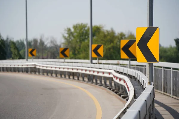 stock image Almaty, Kazakhstan - 04.26.2022 : Metal fencing and reflective signs at the roundabout.