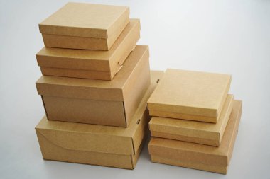 Cardboard boxes for gifts, parcels, delivery of goods are stacked on the table