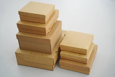 Cardboard boxes for gifts, parcels, delivery of goods are stacked on the table