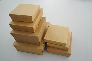 Cardboard boxes for gifts, parcels, delivery of goods are stacked on the table