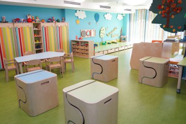Almaty, Kazakhstan - 10.12.2022 : A kindergarten room with decorative elements, educational toys and inventory.