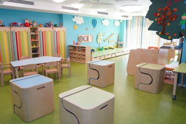 Almaty, Kazakhstan - 10.12.2022 : A kindergarten room with decorative elements, educational toys and inventory.