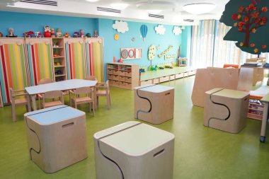 Almaty, Kazakhstan - 10.12.2022 : A kindergarten room with decorative elements, educational toys and inventory.