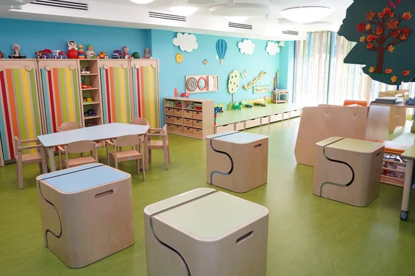 Almaty, Kazakhstan - 10.12.2022 : A kindergarten room with decorative elements, educational toys and inventory.