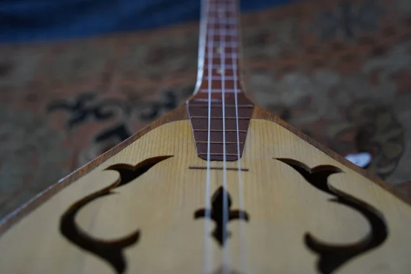 stock image Almaty, Kazakhstan - 03.17.2021 : Ancient national musical stringed instruments with Kazakh ornament.