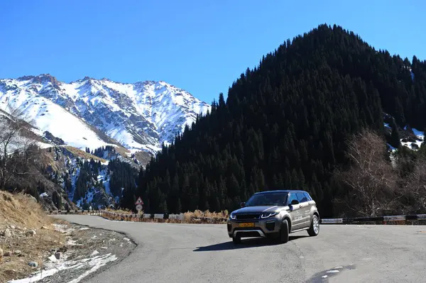 stock image Almaty, Kazakhstan - 02.29.2016 : A test drive of a Range Rover Evoque car in a mountainous area in the winter season.