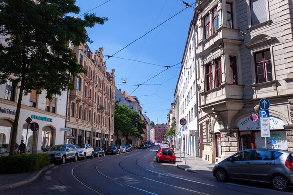 MUNICH, BAVARIA, GERMANY - AUGUST 23, 2022: People play ptanque on the street near the Kunstverein Munchen